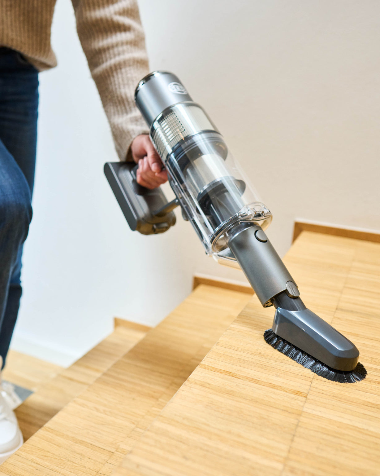 SEBO BALANCE A1 cordless stick vacuum in handheld mode with dusting brush to clean stairs and walls