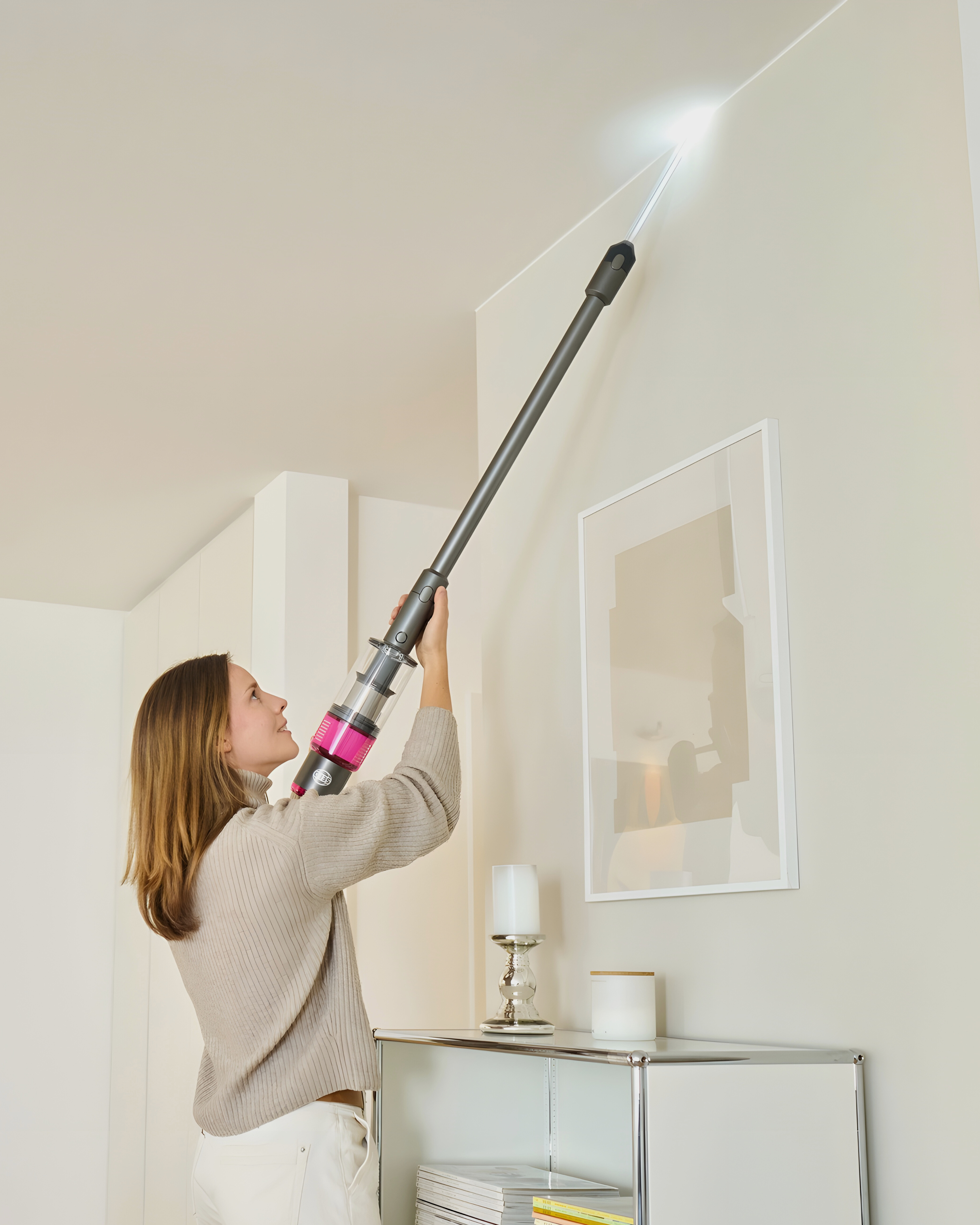 SEBO Balance A1 cordless vacuum crevice tool with LED light reaching high ceiling corner