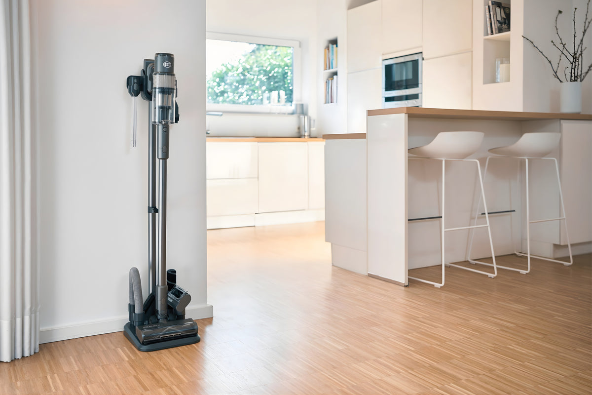 SEBO Balance A1 on its tool storage stand in a kitchen.