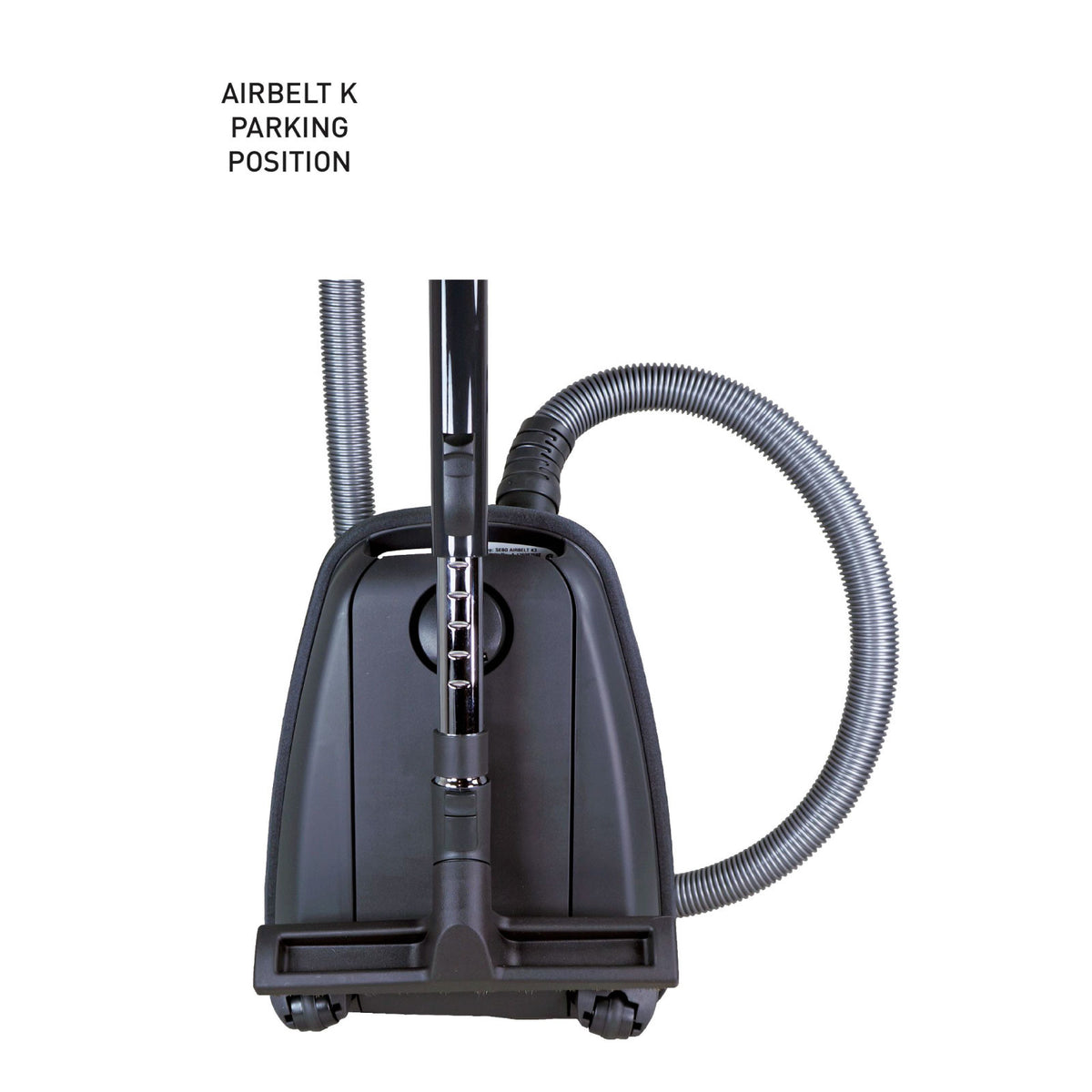 Dark blue SEBO Airbelt K2 Kombi canister vacuum in its parking position with the hose looped over the handle.