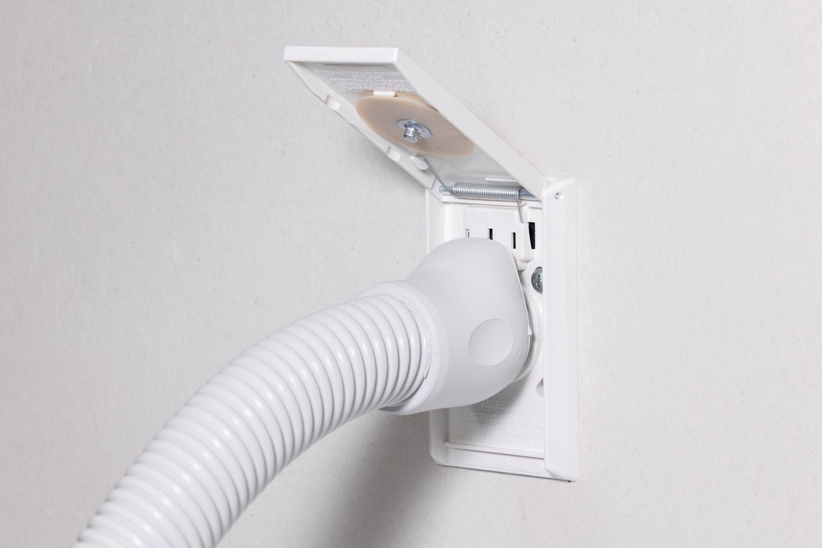 VacuFlo TurboGrip hose plugged into a wall inlet.