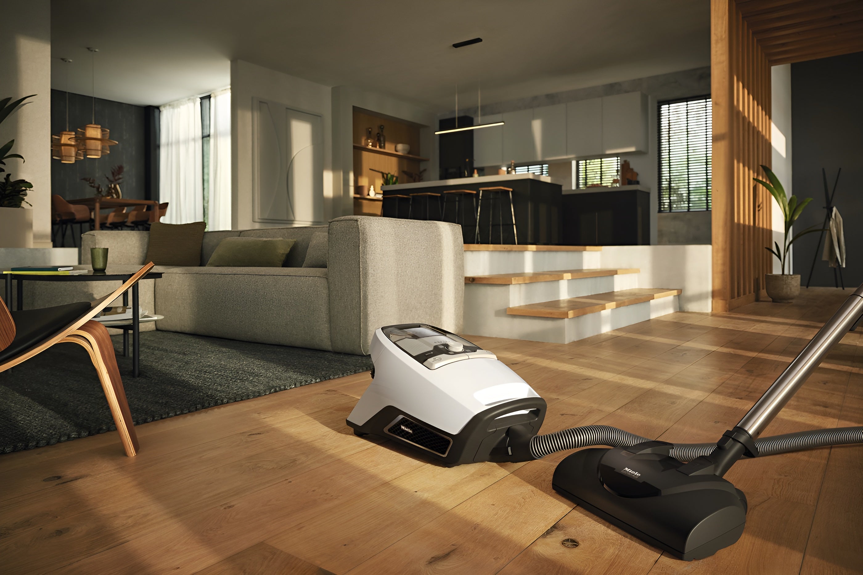 Miele Blizzard CX1 Cat & Dog Bagless Vacuum on a wooden floor in a modern living room