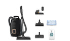 Miele Guard L1 AllFloor canister vacuum cleaner set shown on a plain white background, including the main canister vacuum, wand, several floor attachments, HEPA Filter 