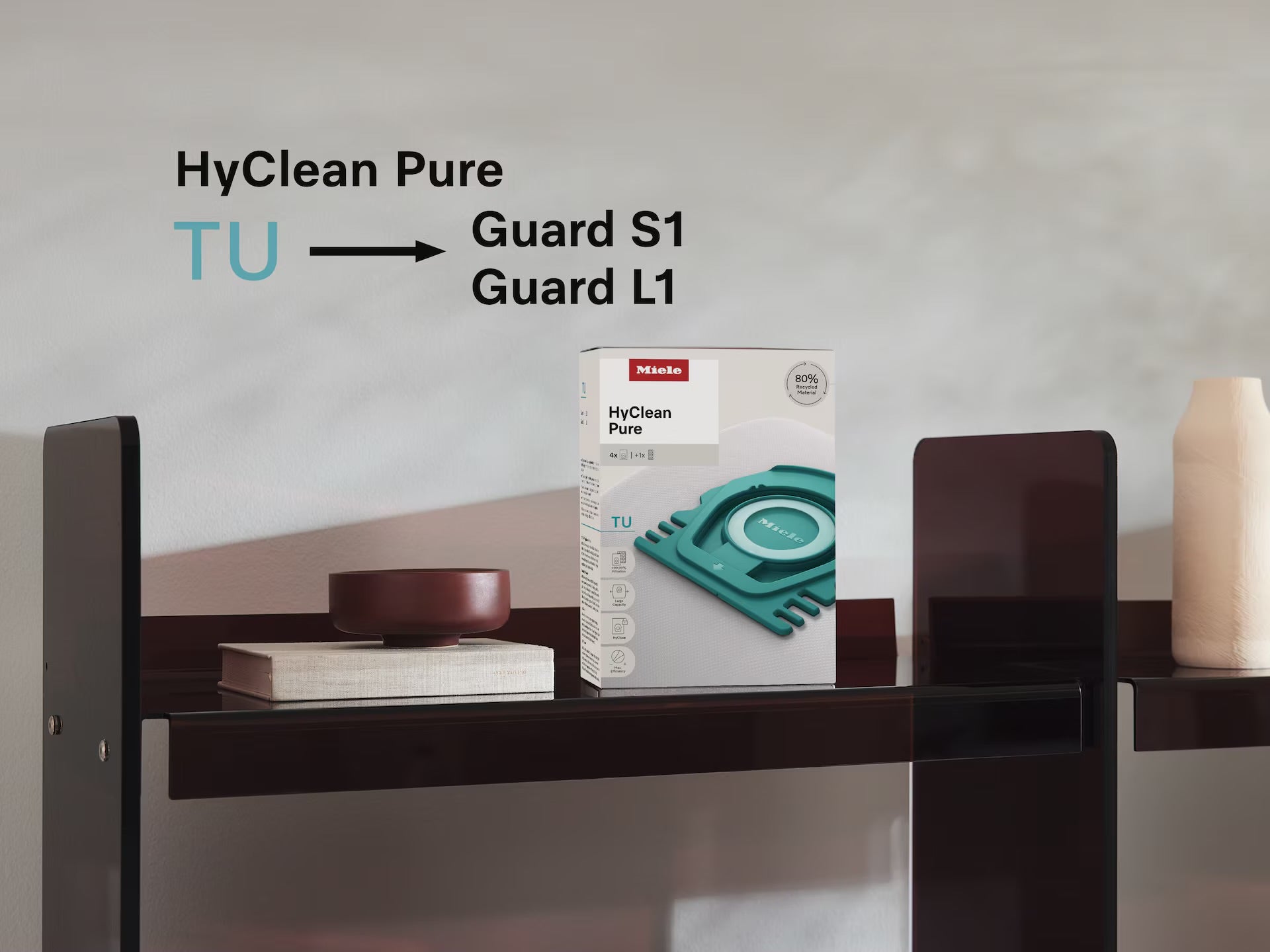 Miele HyClean Pure TU product packaging on a shelf with text indicating different models.
