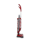 Red SEBO Felix Premium upright vacuum with hose extended, shown at an angle on a white background.