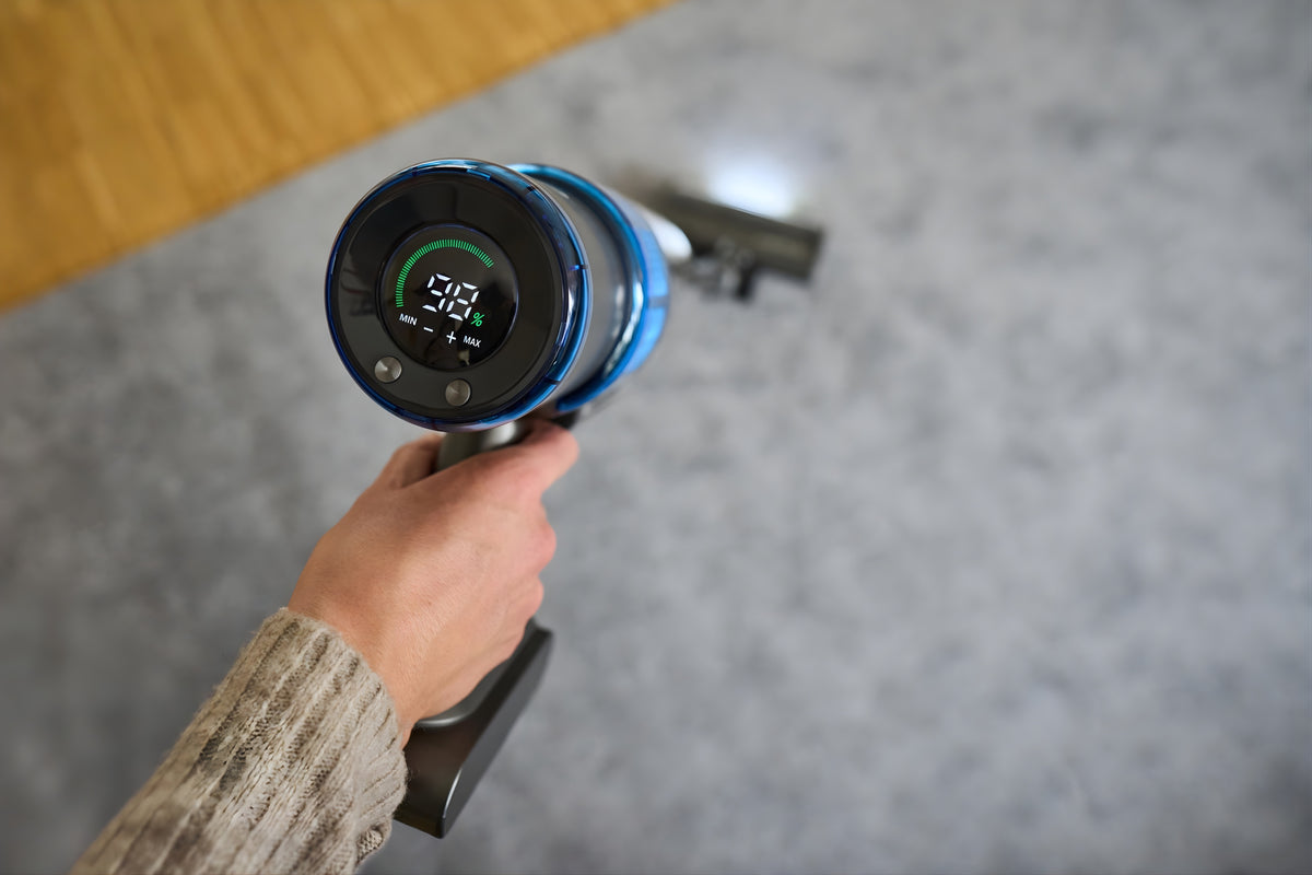 SEBO Balance A1 in blue showing its LED battery charge display.