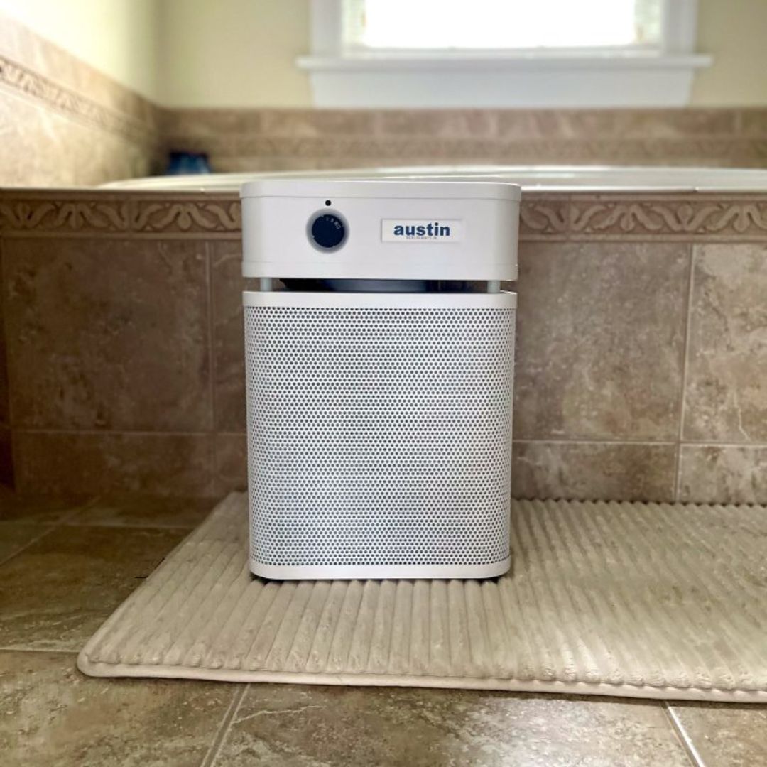 Austin Air HealthMate Junior on a bath mat in a bathroom