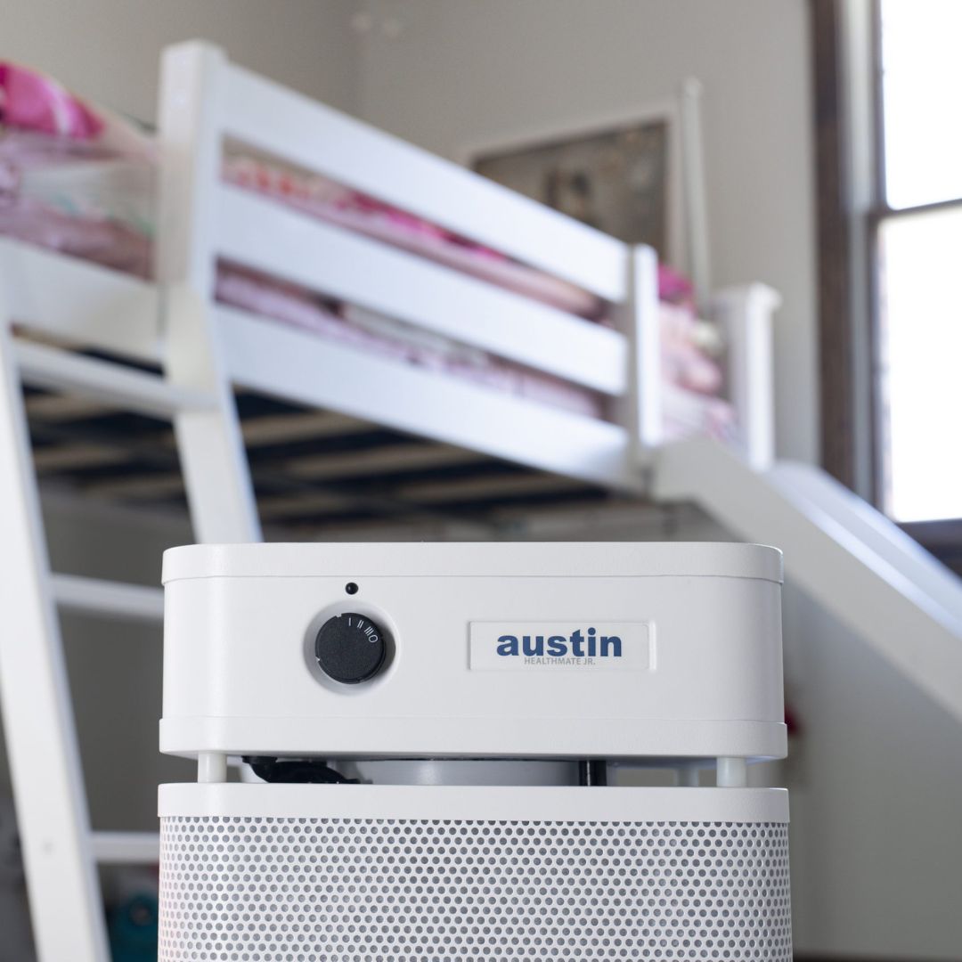 White Austin Air HealthMate Junior in a children's bedroom with bunk beds
