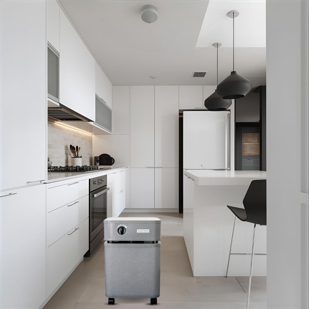 Graphite Austin Air Immunity Machine on the floor of a modern white kitchen
