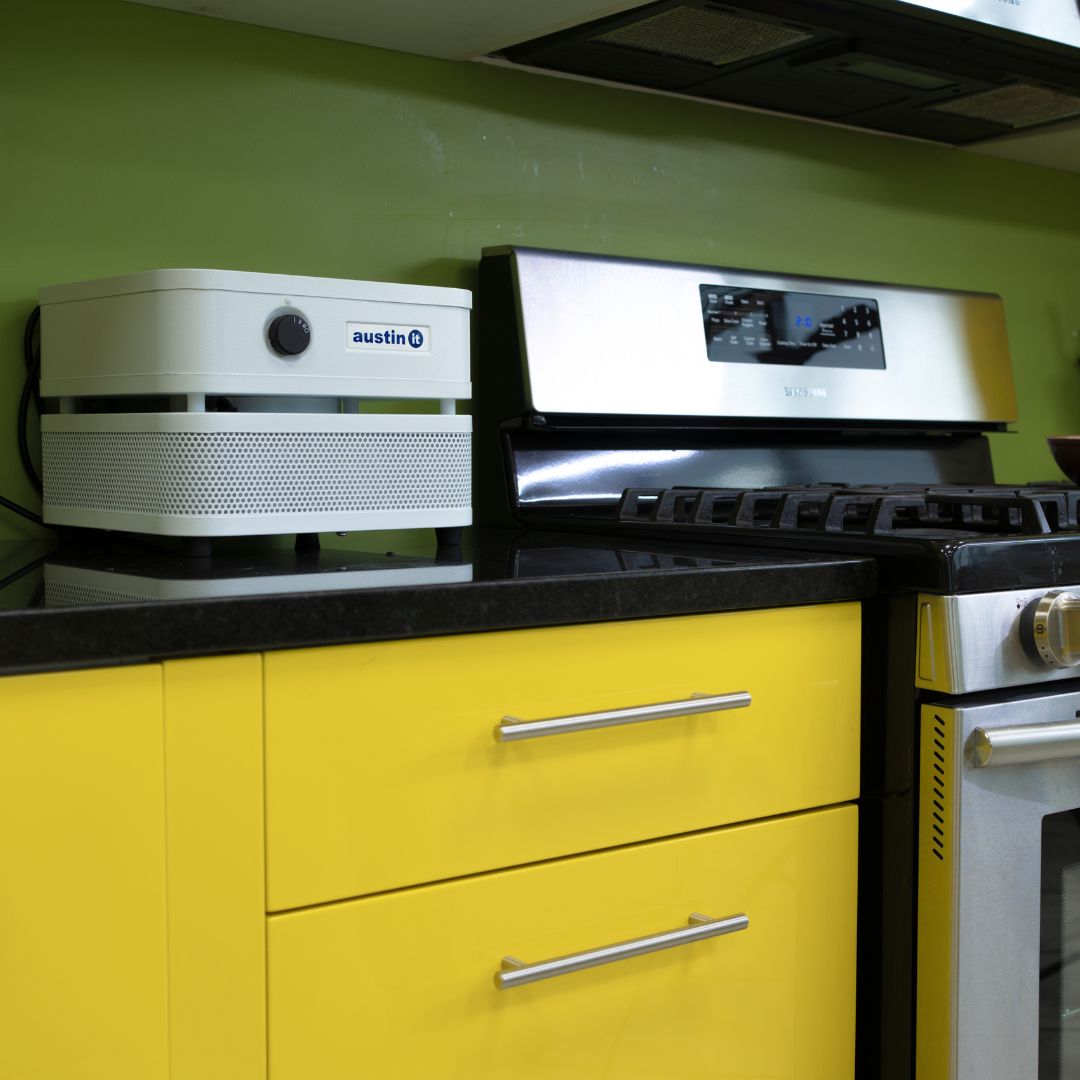 Austin Air “it” on a kitchen counter with yellow cabinets