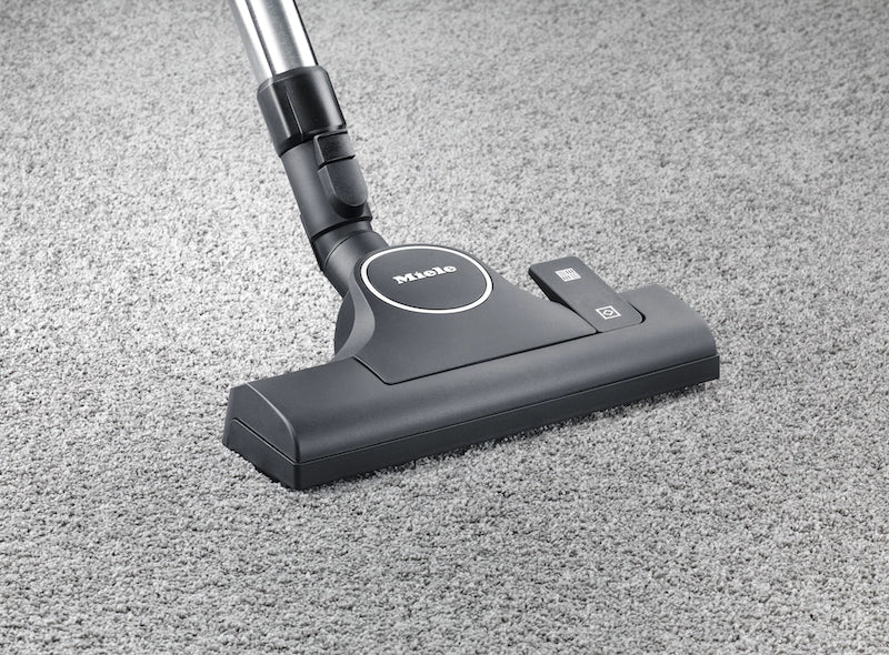 Miele Classic C1 Pure Suction HomeCare floor head on carpet.