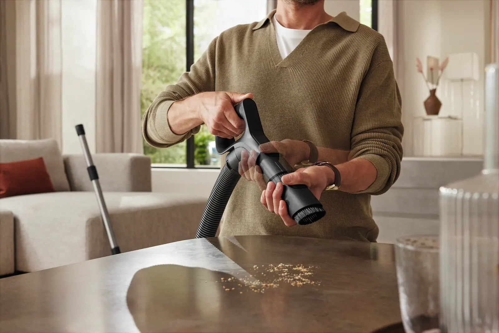 Miele Guard comfort handle with built-in dusting brush.