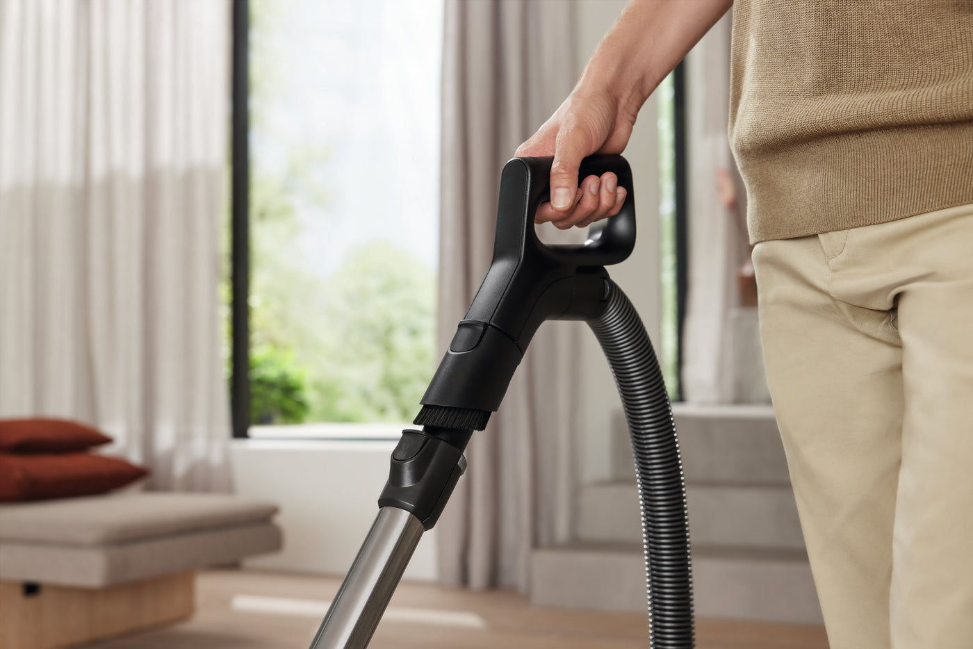 Miele Guard L1 EcoComfort handle in hand.
