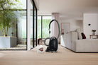 Miele Guard M1 canister in a bright living room.