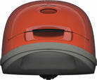 Close-up of the red Miele Guard M1 Terra Red canister vacuum's curved top.