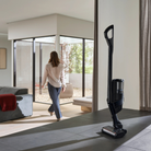 Miele Triflex HX3 Aqua standing free in a living room without a wall bracket, thanks to its park position.