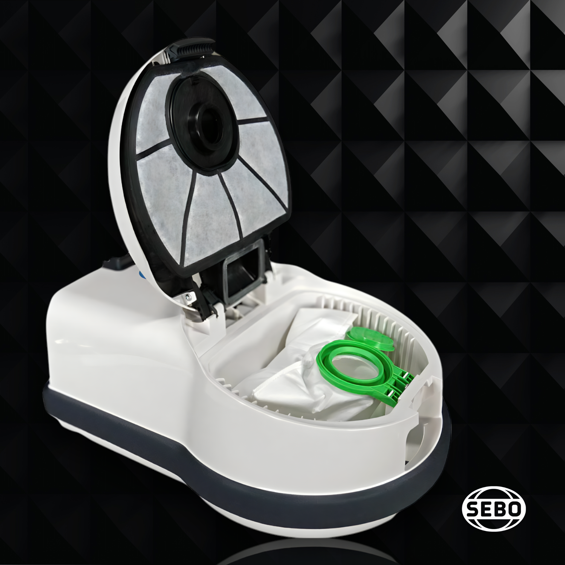 Top view of the SEBO Airbelt D Series canister vacuum with the lid open, showing the bag compartment and green sealing cap.