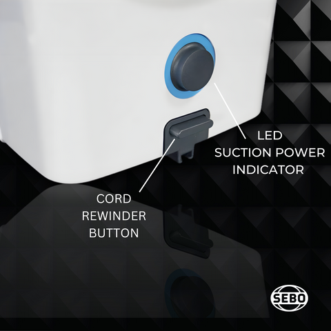 Close-up of the SEBO Airbelt D Series canister vacuum's cord rewinder button and LED suction power indicator.