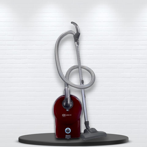 SEBO Airbelt D1 Turbo canister vacuum in Black Cherry with hose attached.