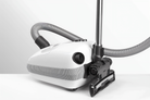 White SEBO Airbelt E1 Kombi canister vacuum with the wand parked.