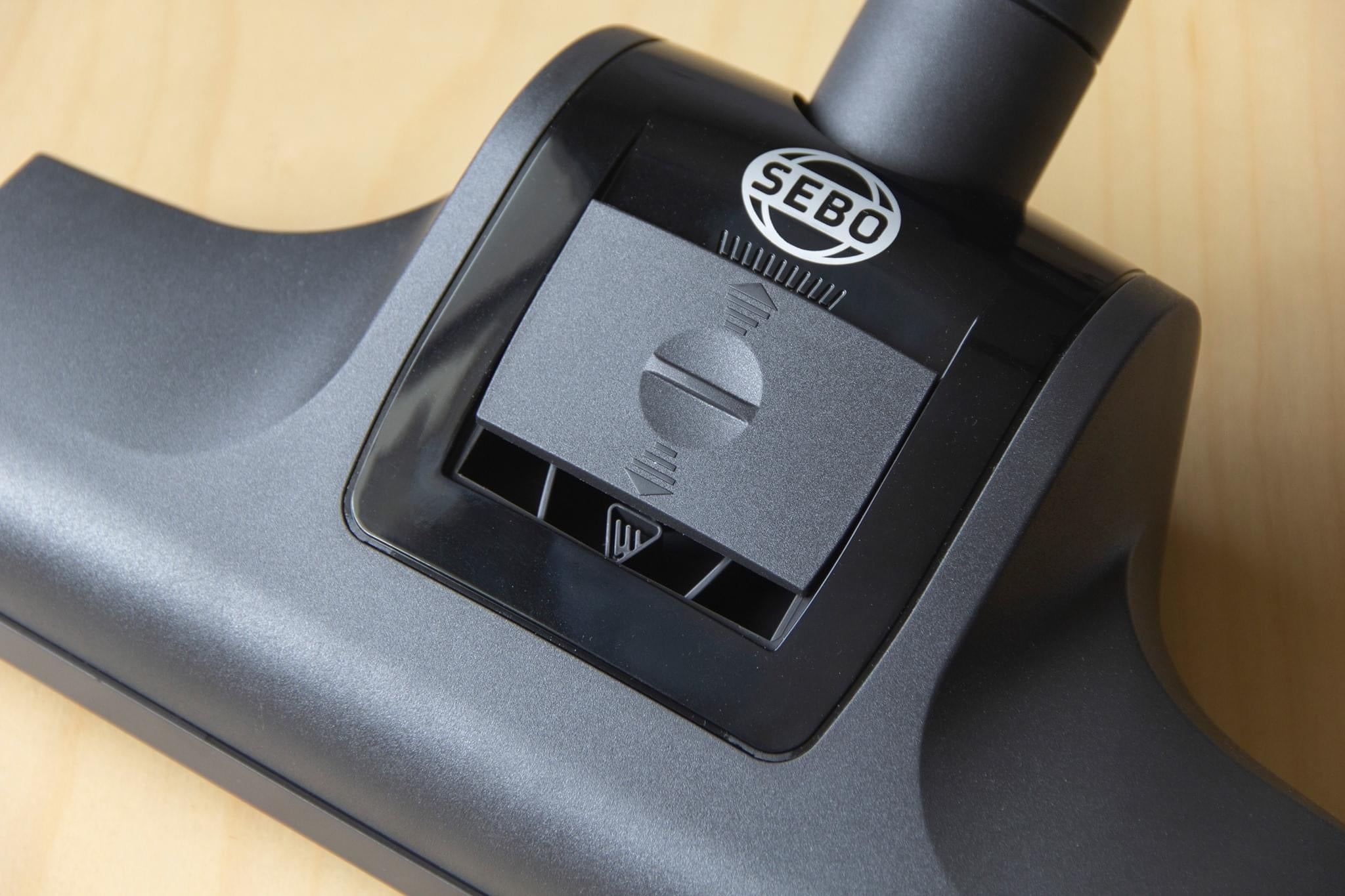 Close-up of the SEBO turbo head floor nozzle for the Airbelt K2 Turbo canister vacuum, shown on a hardwood floor.