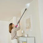 SEBO Balance A1 light-up crevice tool reaching a ceiling corner.