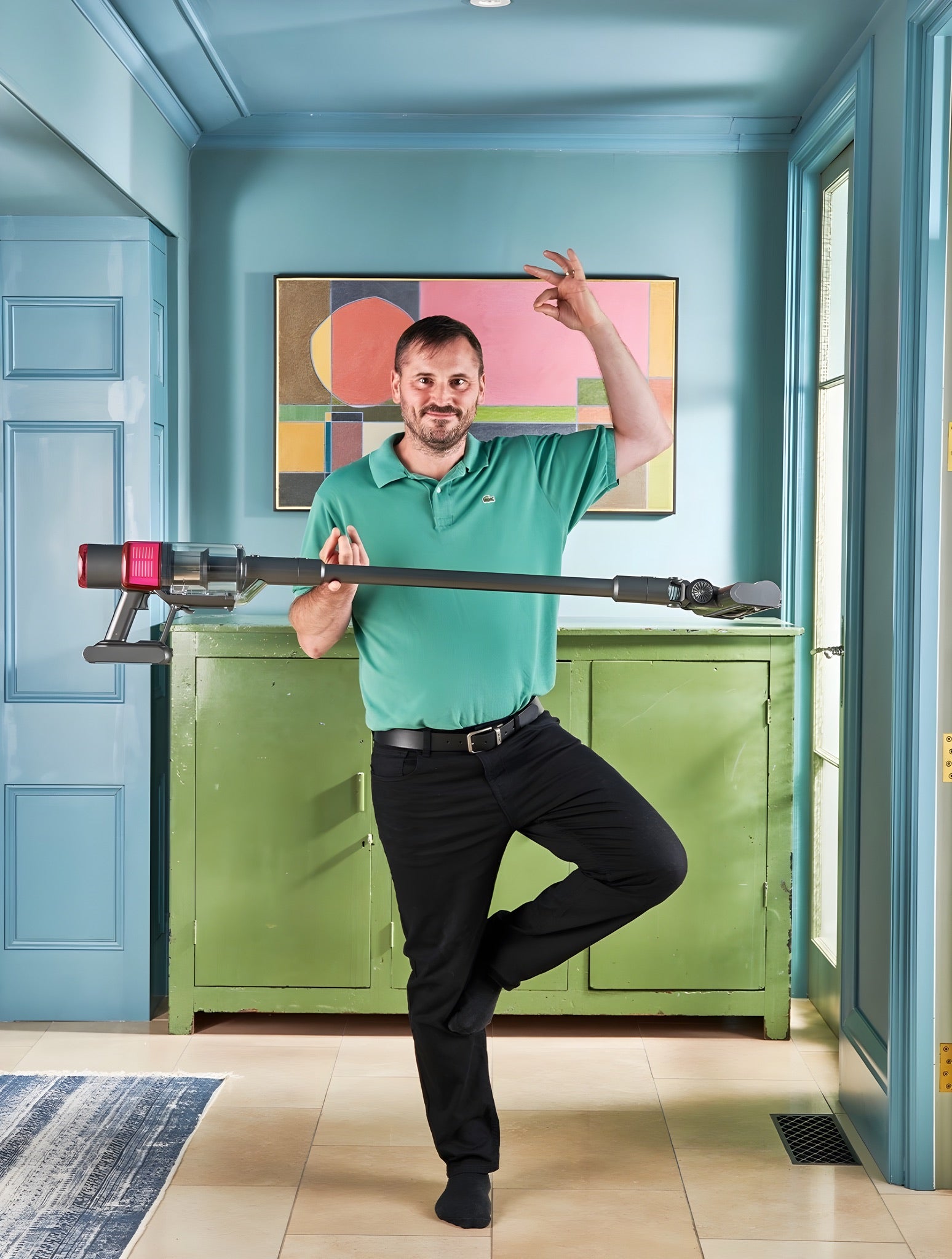 Man balancing on one foot holding the lightweight SEBO Balance A1.