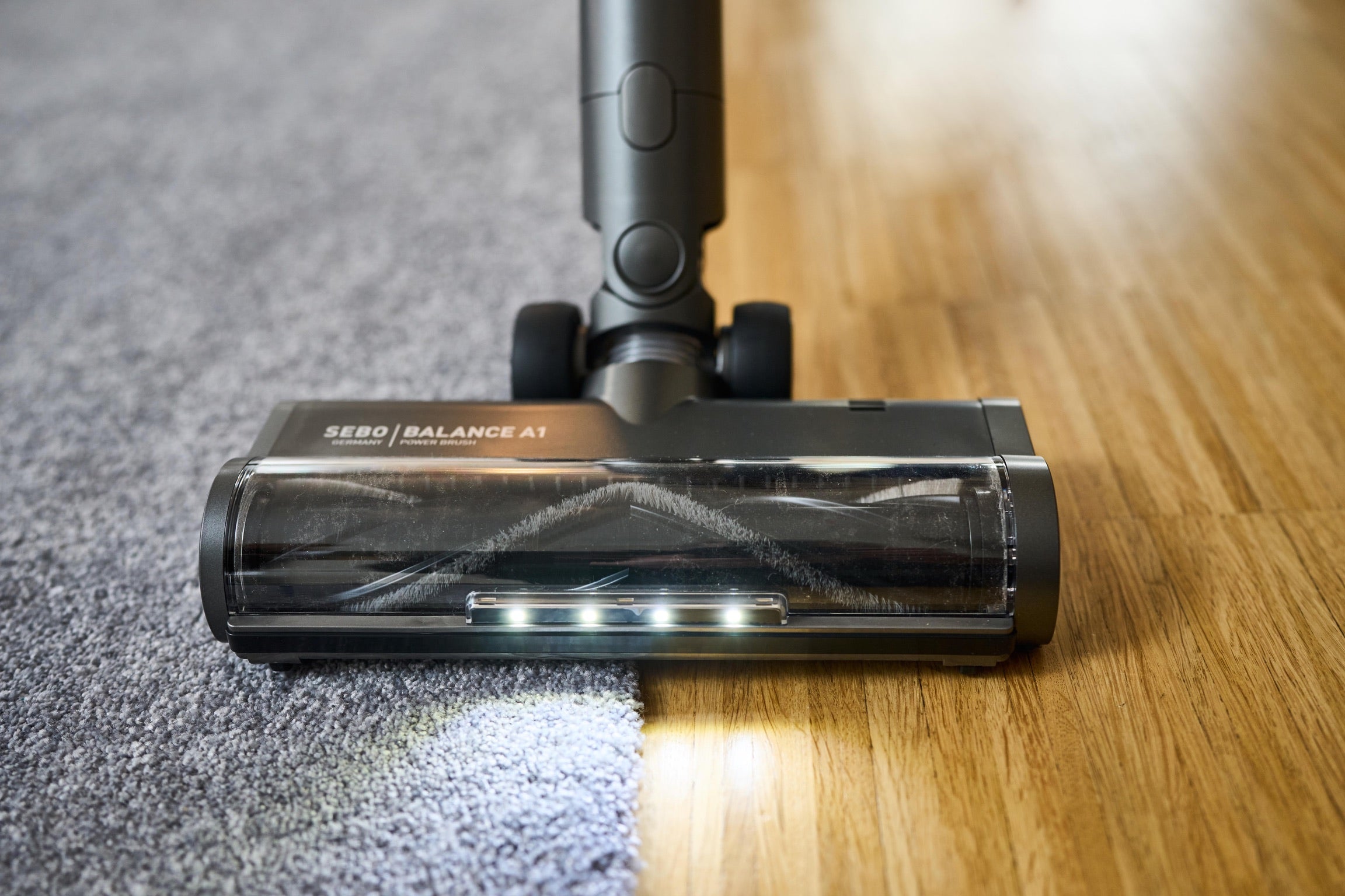 SEBO Balance A1 powerhead moving from rug to bare floor.