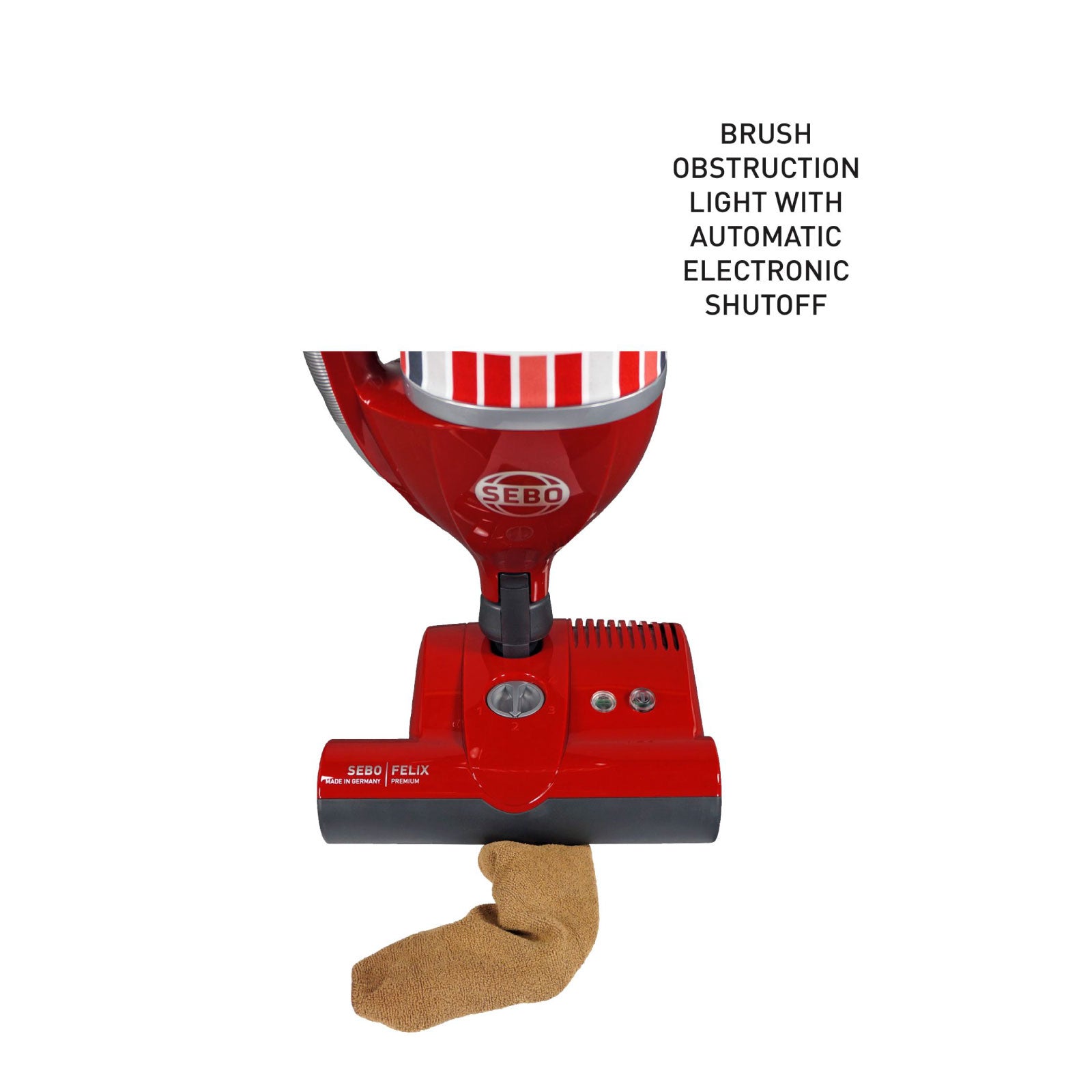 Close-up of the SEBO Felix Premium's brush head showing the obstruction light with automatic electronic shutoff, on a wood floor.