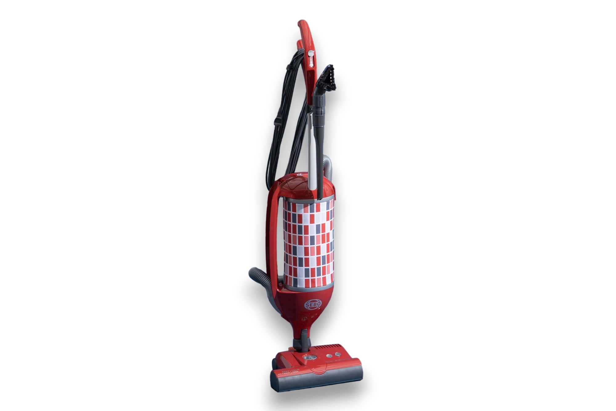 Red and white checkered SEBO Felix Premium upright vacuum shown at an angle.