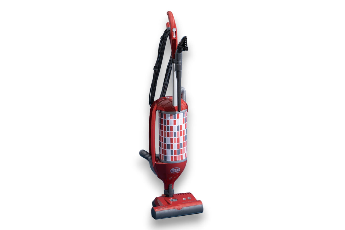 Red and white checkered SEBO Felix Premium upright vacuum shown at an angle.